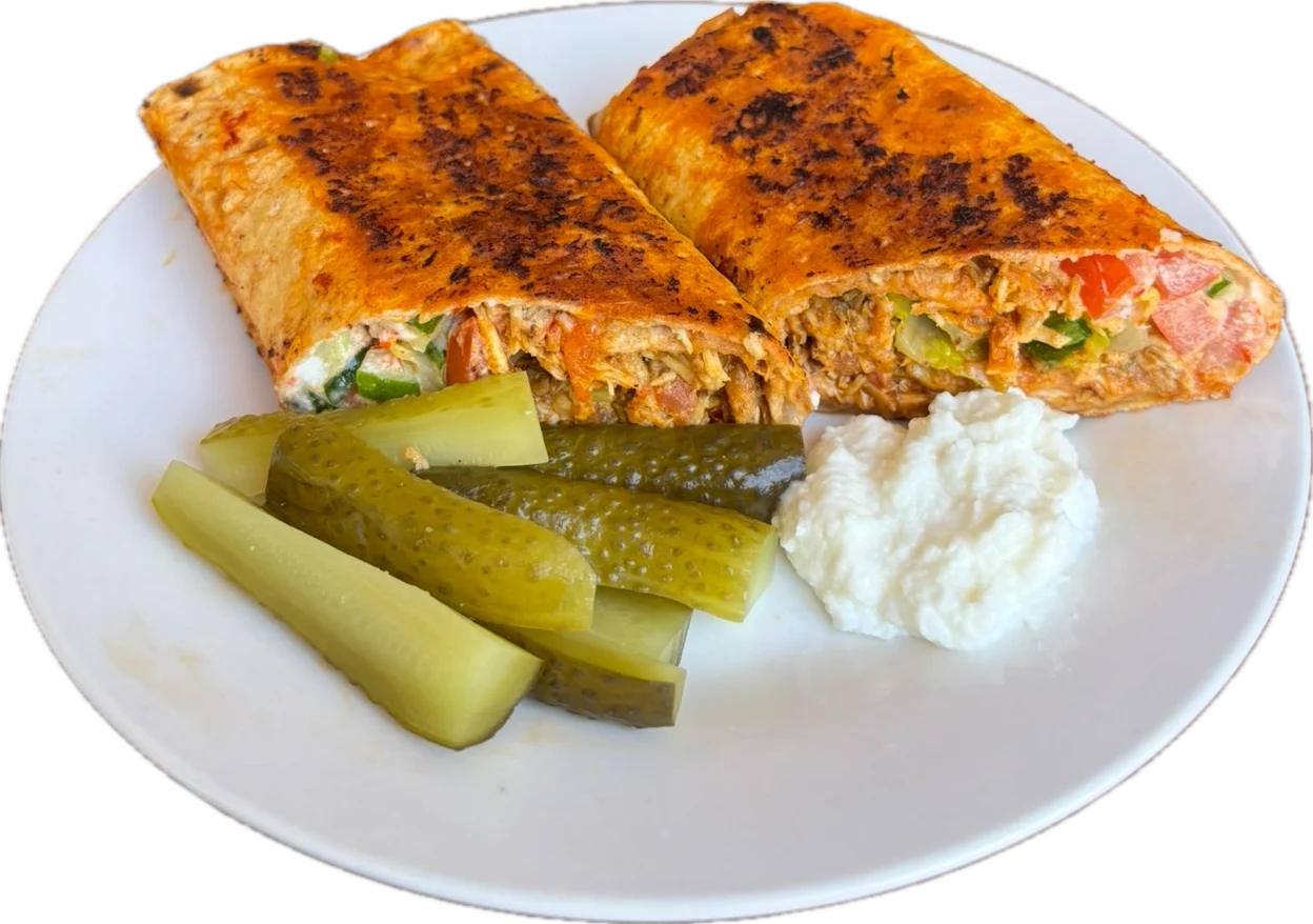 Kolaj Chicken Shawarma - Chicken with garlic dip, pickles, tomatoes, and lettuce.